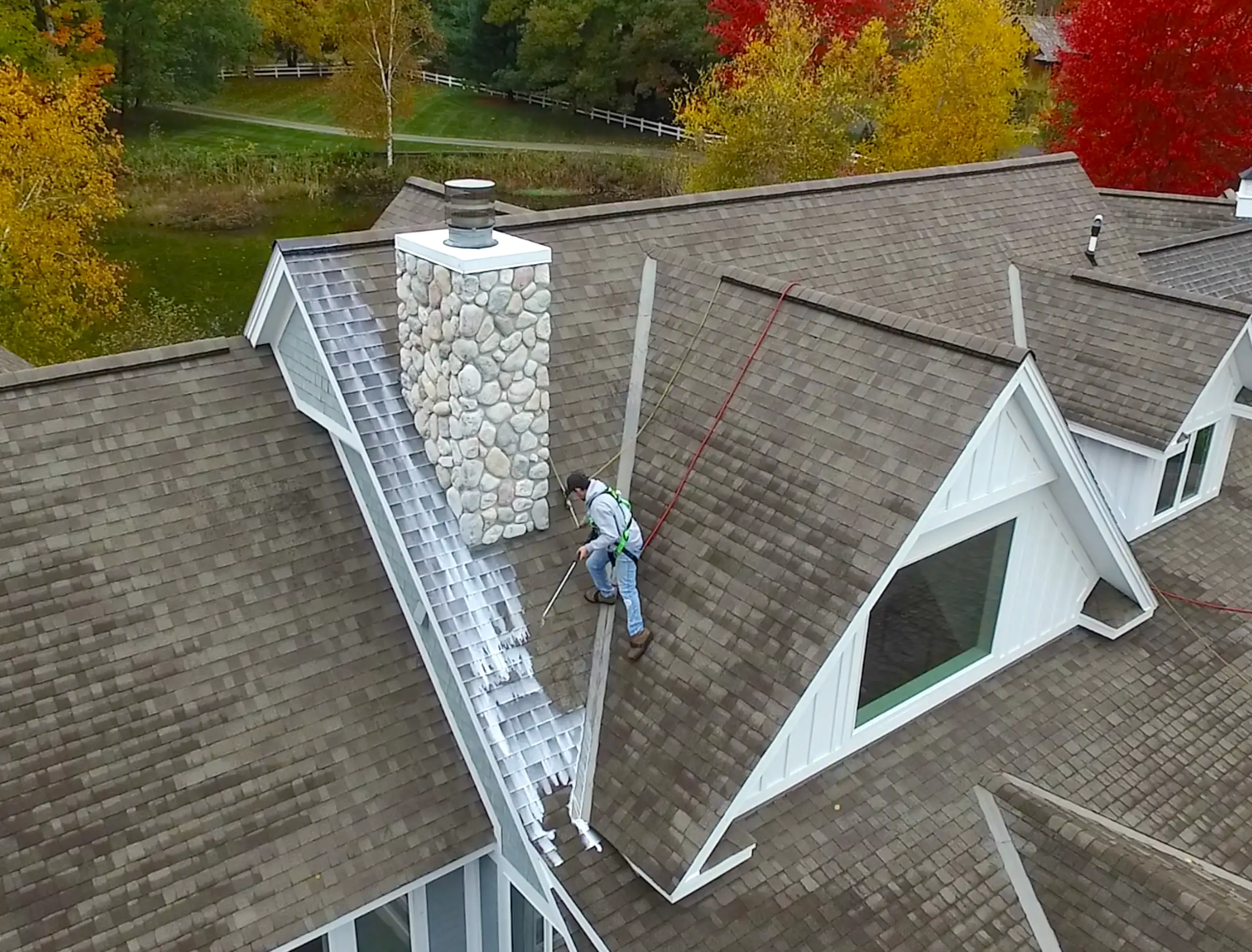 Asphalt shingle roof treated by Roof Renewal in Northern Michigan